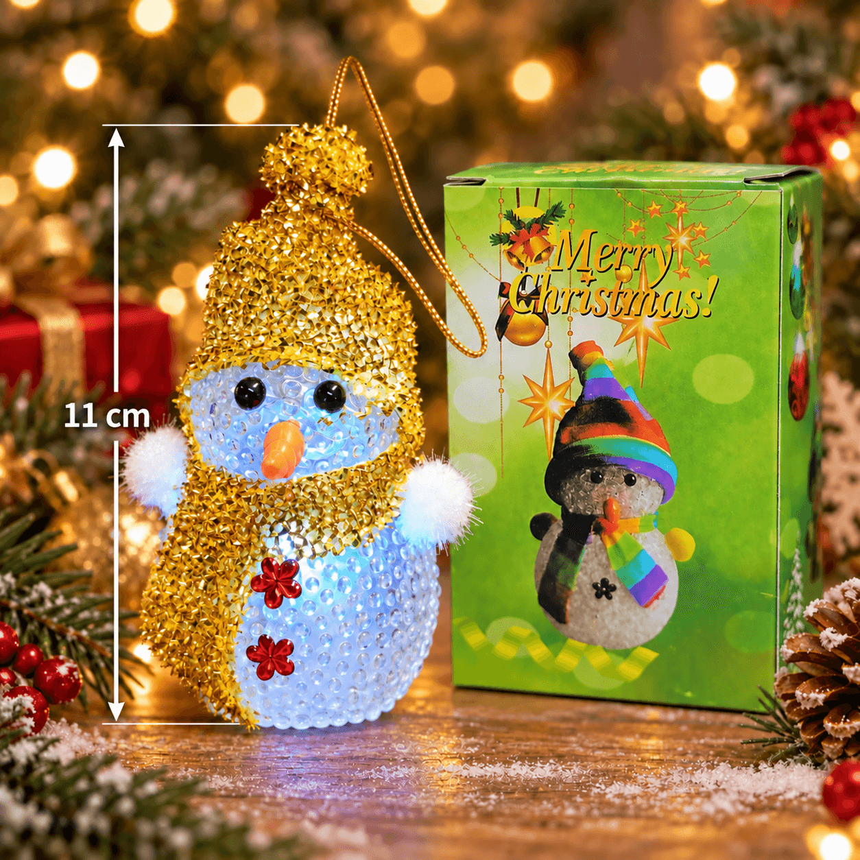 Muñeco de nieve con bufanda y gorro dorado con luz 13cm